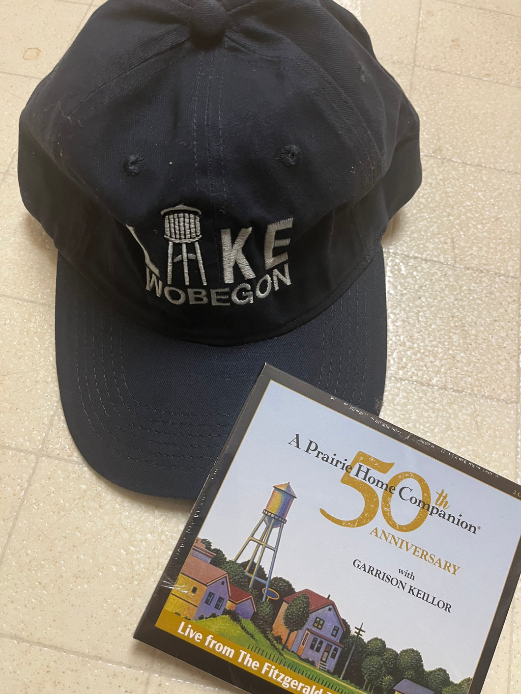 Lake Wobegon Watertower hat and 50th Anniversary CD Duo